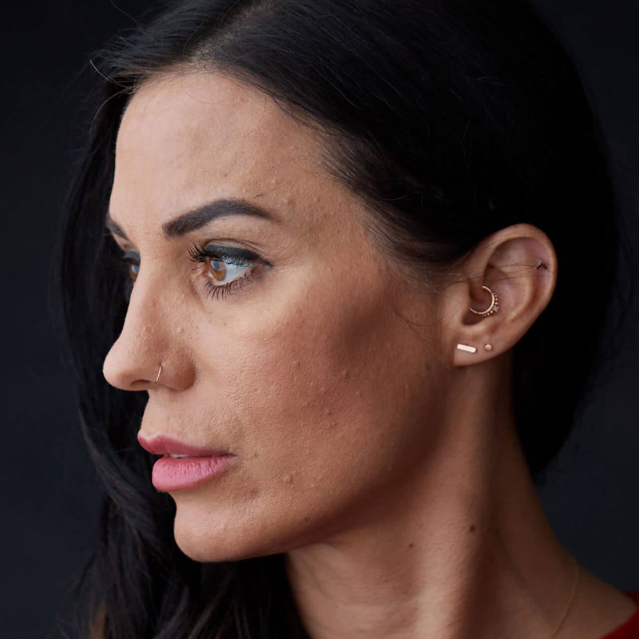 Before: Portrait of a dark-haired woman with a calm expression